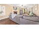 Comfortable living room with a stone fireplace, large sectional sofa, and lots of natural light from the windows at 60 Bartlett Way, Dallas, GA 30157