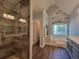 Bathroom boasts a glass-enclosed shower, double sinks, and a soaking tub for relaxation at 60 Bartlett Way, Dallas, GA 30157