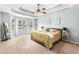 This main bedroom is spacious and bright, featuring trey ceilings and large windows at 60 Bartlett Way, Dallas, GA 30157