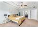 Relaxing main bedroom showcases tray ceilings, soft carpet, and access to the ensuite bath at 60 Bartlett Way, Dallas, GA 30157