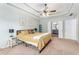 This main bedroom is spacious and bright, featuring trey ceilings and carpeted floors at 60 Bartlett Way, Dallas, GA 30157
