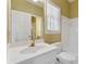Bright bathroom with vanity, modern faucet, and a shower-tub combo at 770 Raleigh Sw Ct, Marietta, GA 30064