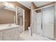 Bathroom with a glass-enclosed shower, vanity, and tile floors at 770 Raleigh Sw Ct, Marietta, GA 30064