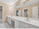 Bathroom featuring an oversized vanity, dual sinks, tile floors and an oversized mirror at 770 Raleigh Sw Ct, Marietta, GA 30064