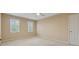 Spacious bedroom with carpeted floors, a ceiling fan, and natural light from two windows at 770 Raleigh Sw Ct, Marietta, GA 30064