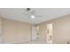 Bedroom featuring a ceiling fan, neutral walls, an ensuite bathroom, and a walk in closet at 770 Raleigh Sw Ct, Marietta, GA 30064