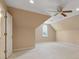 Attic bedroom featuring a ceiling fan, carpeted floors and a window at 770 Raleigh Sw Ct, Marietta, GA 30064