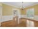 Dining room with hardwood floors, chandelier and large windows at 770 Raleigh Sw Ct, Marietta, GA 30064