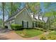 Home with driveway and charming landscaping, green lawn, shrubs and a brick walkway at 770 Raleigh Sw Ct, Marietta, GA 30064