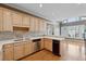 Kitchen with light wood cabinets, stainless steel appliances, and hardwood floors at 770 Raleigh Sw Ct, Marietta, GA 30064