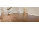 Open living room with hardwood floors and staircase access at 770 Raleigh Sw Ct, Marietta, GA 30064