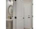 Elegant powder room featuring pedestal sink and modern fixtures at 116 Winsome Way, Woodstock, GA 30188
