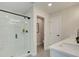 Modern bathroom featuring a glass shower with a black trim and a white vanity with a stone countertop at 116 Winsome Way, Woodstock, GA 30188