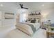 Bright bedroom featuring a neutral color palette, walk-in closet, and ceiling fan at 116 Winsome Way, Woodstock, GA 30188