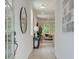 Inviting hallway with wood floors, stylish décor, and views into the living area, creating a warm welcome at 116 Winsome Way, Woodstock, GA 30188