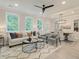 Bright living room with neutral tones, a ceiling fan, and an open dining area at 116 Winsome Way, Woodstock, GA 30188