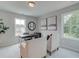 Bright office space featuring large windows with scenic views, and minimalist furniture at 116 Winsome Way, Woodstock, GA 30188