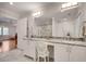 Bright bathroom with double sinks, marble floors, and a glass-enclosed shower at 1802 N Akin Ne Dr, Atlanta, GA 30345