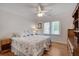 Bright bedroom featuring two twin beds, hardwood floors, and a ceiling fan at 1802 N Akin Ne Dr, Atlanta, GA 30345
