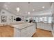 Open-concept kitchen featuring an island, granite countertops, stainless steel appliances, and hardwood floors at 1802 N Akin Ne Dr, Atlanta, GA 30345