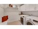 Well-lit laundry room with modern washer and dryer, plus built-in storage at 1802 N Akin Ne Dr, Atlanta, GA 30345