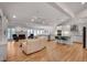Open-concept living room with a fireplace, kitchen, and hardwood flooring at 1802 N Akin Ne Dr, Atlanta, GA 30345