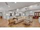 Spacious living room featuring hardwood floors, a large sectional sofa, and an open layout at 1802 N Akin Ne Dr, Atlanta, GA 30345