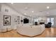 Spacious living area featuring built-in shelving, ceiling fan, and hardwood floors at 1802 N Akin Ne Dr, Atlanta, GA 30345