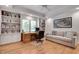 Home office with built-in bookshelves, hardwood floors, and natural light at 1802 N Akin Ne Dr, Atlanta, GA 30345