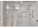 Modern shower with a glass door, dual showerheads, and a built-in niche at 1802 N Akin Ne Dr, Atlanta, GA 30345
