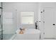 Modern bathroom showcasing a freestanding tub, glass shower, and contemporary fixtures at 2564 Walden Estates Dr, Marietta, GA 30062