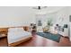 Bright bedroom featuring wood floors, a ceiling fan, and windows providing lots of natural light at 2564 Walden Estates Dr, Marietta, GA 30062