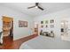 Bedroom featuring wood floors, a ceiling fan, with a peek into the attached closet at 2564 Walden Estates Dr, Marietta, GA 30062