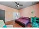 Cozy bedroom showcasing wood floors, with a modern bed frame and a hanging plant at 2564 Walden Estates Dr, Marietta, GA 30062