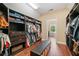 Walk-in closet with custom shelving, drawers, and ample storage space for clothing and accessories at 2564 Walden Estates Dr, Marietta, GA 30062