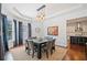 Elegant dining room featuring a modern chandelier and an adjacent kitchen at 2564 Walden Estates Dr, Marietta, GA 30062