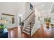 Inviting foyer with wood floors, staircase, and natural light flowing through the front door at 2564 Walden Estates Dr, Marietta, GA 30062