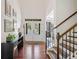 Bright foyer with hardwood floors, high ceilings, staircase and double doors with glass inserts at 2564 Walden Estates Dr, Marietta, GA 30062