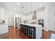 Bright kitchen with white cabinets, stainless steel appliances, blue island and hardwood floors at 2564 Walden Estates Dr, Marietta, GA 30062