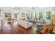 Open-concept living room with modern furniture, hardwood floors, and views into the dining room and kitchen at 2564 Walden Estates Dr, Marietta, GA 30062