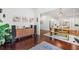 Open living space showcasing hardwood floors, speakers, and a view of the dining room and gourmet kitchen at 2564 Walden Estates Dr, Marietta, GA 30062