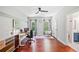 Home office featuring wood floors, neutral walls, large windows and modern furnishings at 2564 Walden Estates Dr, Marietta, GA 30062