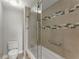 This tiled shower/tub features a glass door and built-in seat for relaxing at 3475 Oak Valley Road Ne # 870, Atlanta, GA 30326