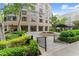 Beautifully landscaped courtyard with manicured hedges, walking paths, and a serene fountain feature at 3475 Oak Valley Road Ne # 870, Atlanta, GA 30326