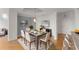 Open dining room with modern decor, stylish chandelier, and bright natural light at 3475 Oak Valley Road Ne # 870, Atlanta, GA 30326