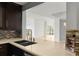 Open kitchen featuring quartz countertops and dark wood cabinets at 3475 Oak Valley Road Ne # 870, Atlanta, GA 30326