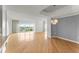 Spacious living area featuring hardwood floors, recessed lighting, and an elegant chandelier at 3475 Oak Valley Road Ne # 870, Atlanta, GA 30326