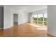 Bright, open living room featuring hardwood floors, large windows, and neutral paint at 3475 Oak Valley Road Ne # 870, Atlanta, GA 30326