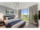 This spacious main bedroom features a plush bed, modern lighting, a large window, and stylish décor at 3475 Oak Valley Road Ne # 870, Atlanta, GA 30326