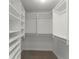 This spacious walk-in closet features custom shelving and ample storage space for organized living at 3475 Oak Valley Road Ne # 870, Atlanta, GA 30326